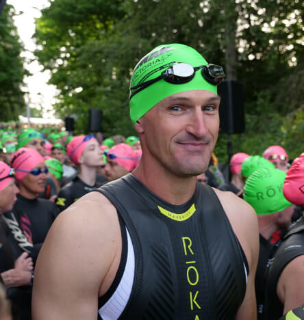 Stephen in a wetsuit before an Ironman race